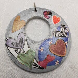 Handmade collages on a wood pendant